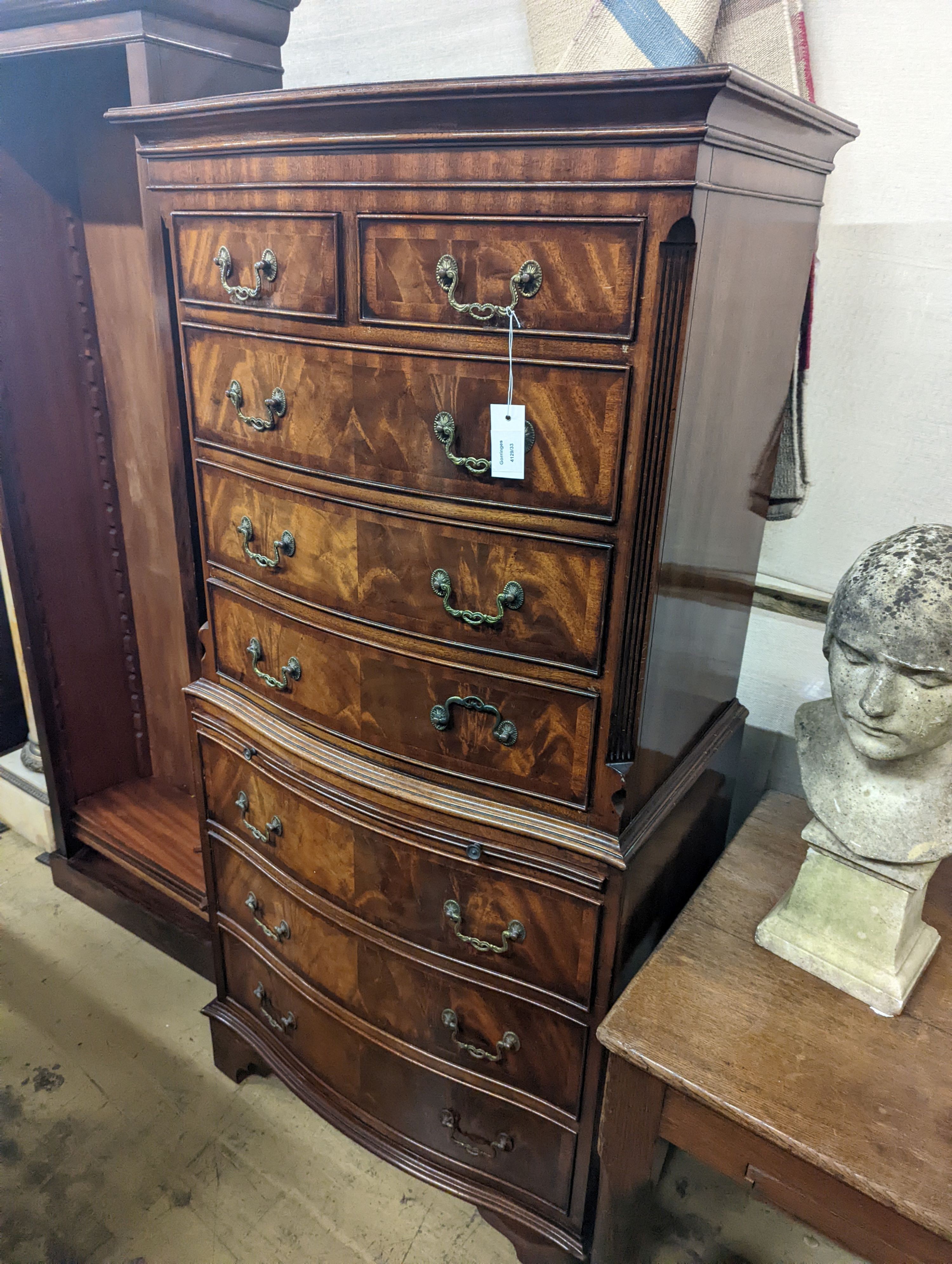 A reproduction George III style mahogany bow front tallboy fitted slide, width 73cm, depth 48cm, height 152cm